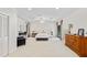 Airy main bedroom featuring neutral tones, a ceiling fan, and ample space for a sitting area and furnishings at 4714 Elder Berry Dr, Sarasota, FL 34241