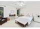 Cozy main bedroom with a ceiling fan, large window, and comfortable furnishings at 4714 Elder Berry Dr, Sarasota, FL 34241
