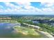 Aerial view of Watercrest community, lake, and golf course at 6438 Watercrest Way # 204, Lakewood Ranch, FL 34202