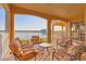 Spacious balcony with lake views and seating at 6438 Watercrest Way # 204, Lakewood Ranch, FL 34202