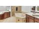 Bathroom features double vanities, a soaking tub, and a walk-in shower at 6438 Watercrest Way # 204, Lakewood Ranch, FL 34202