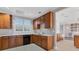 Full kitchen in community area with wood cabinets at 6438 Watercrest Way # 204, Lakewood Ranch, FL 34202