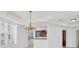 Dining area with hardwood floors and a kitchen with dark wood cabinets at 6438 Watercrest Way # 204, Lakewood Ranch, FL 34202