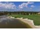 Waterfront golf course with sand traps and lush green at 6438 Watercrest Way # 204, Lakewood Ranch, FL 34202
