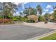 Gated community entrance with guard house and fountain at 6438 Watercrest Way # 204, Lakewood Ranch, FL 34202