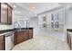 Kitchen boasts dark wood cabinets, stainless steel appliances and a large window at 6438 Watercrest Way # 204, Lakewood Ranch, FL 34202
