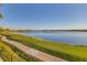 Peaceful lakefront view with walking path at 6438 Watercrest Way # 204, Lakewood Ranch, FL 34202