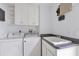 Laundry room with washer, dryer, and cabinets at 6438 Watercrest Way # 204, Lakewood Ranch, FL 34202