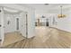 Bright living room featuring hardwood floors and access to a screened balcony at 6438 Watercrest Way # 204, Lakewood Ranch, FL 34202