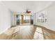 Living room with hardwood floors, a balcony, and lake views at 6438 Watercrest Way # 204, Lakewood Ranch, FL 34202