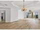 Spacious living room with hardwood floors, a chandelier, and large windows at 6438 Watercrest Way # 204, Lakewood Ranch, FL 34202