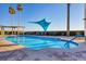 Relaxing pool area with a blue shade sail at 6438 Watercrest Way # 204, Lakewood Ranch, FL 34202