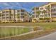 Waterfront condos with balconies and palm trees at 6438 Watercrest Way # 204, Lakewood Ranch, FL 34202