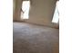 Spacious bedroom with neutral carpeting and dual windows at 4160 Fruitville Rd # 13, Sarasota, FL 34232