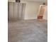 Cozy bedroom with soft carpet, a large closet with curtains, and a glimpse of the bathroom at 4160 Fruitville Rd # 13, Sarasota, FL 34232