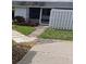 Private entrance with a walkway and landscaping at 4160 Fruitville Rd # 13, Sarasota, FL 34232