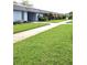 Charming single-story condo with well-maintained landscaping and inviting walkway leading to the front door at 4160 Fruitville Rd # 13, Sarasota, FL 34232