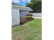 Condo building with well-manicured landscaping along the property line at 4160 Fruitville Rd # 13, Sarasota, FL 34232