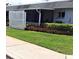Neatly landscaped exterior with a white picket fence at 4160 Fruitville Rd # 13, Sarasota, FL 34232