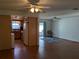 Open concept kitchen and living area with wood floors and ceiling fans at 4160 Fruitville Rd # 13, Sarasota, FL 34232
