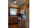 Traditional kitchen with wood cabinets, tile countertops, and stainless steel appliances at 4160 Fruitville Rd # 13, Sarasota, FL 34232