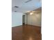Living room with wood flooring and a view into another room at 4160 Fruitville Rd # 13, Sarasota, FL 34232