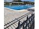 Large community swimming pool with stylish brick surround at 4160 Fruitville Rd # 13, Sarasota, FL 34232