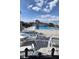 Community pool surrounded by lounge chairs under a blue sky at 4160 Fruitville Rd # 13, Sarasota, FL 34232