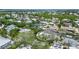 Aerial view of waterfront property nestled in a tropical neighborhood at 562 Juan Anasco Dr, Longboat Key, FL 34228