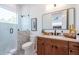 Modern bathroom with a walk-in shower, terrazzo flooring, and a floating vanity at 2430 Floyd St, Sarasota, FL 34239