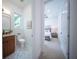 Modern small bathroom with terrazzo flooring, toilet, and sink at 2430 Floyd St, Sarasota, FL 34239