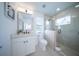 Modern bathroom with a glass shower and white vanity at 2430 Floyd St, Sarasota, FL 34239