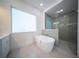 Spa-like bathroom with a soaking tub and walk-in shower at 2430 Floyd St, Sarasota, FL 34239