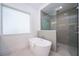 Modern bathroom with a soaking tub and a walk-in shower at 2430 Floyd St, Sarasota, FL 34239