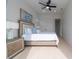 Bright bedroom with a king-size bed, wooden nightstands, and access to a balcony at 2430 Floyd St, Sarasota, FL 34239