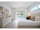 Bright bedroom with sliding glass doors and pool access at 2430 Floyd St, Sarasota, FL 34239