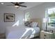 Bright bedroom with a queen bed and private balcony access at 2430 Floyd St, Sarasota, FL 34239