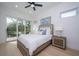 Bedroom with sliding glass doors to a private balcony at 2430 Floyd St, Sarasota, FL 34239