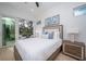 Bedroom with sliding glass doors to a private balcony at 2430 Floyd St, Sarasota, FL 34239