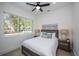 Bright bedroom with large window, double bed, and nightstands at 2430 Floyd St, Sarasota, FL 34239