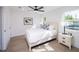 Spacious bedroom with light wood furniture and ceiling fan at 2430 Floyd St, Sarasota, FL 34239