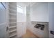 Large walk-in closet with ample shelving and hanging space at 2430 Floyd St, Sarasota, FL 34239