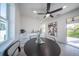 Bright dining area with a round table and access to a balcony at 2430 Floyd St, Sarasota, FL 34239