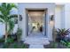 Modern front entrance with double doors opening to a view of the interior at 2430 Floyd St, Sarasota, FL 34239