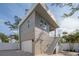 Attached garage with modern gray exterior and white door at 2430 Floyd St, Sarasota, FL 34239