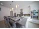Modern kitchen with white cabinets, stainless steel appliances and breakfast bar at 2430 Floyd St, Sarasota, FL 34239