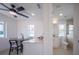Open concept kitchen and bath with modern white cabinets and quartz countertops at 2430 Floyd St, Sarasota, FL 34239