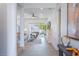 Open living area with fireplace, sliding glass doors, and stairs at 2430 Floyd St, Sarasota, FL 34239