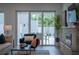 Living area with sliding glass doors opening to backyard pool at 2430 Floyd St, Sarasota, FL 34239