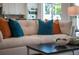 Comfortable living room with off-white sofa and colorful pillows at 2430 Floyd St, Sarasota, FL 34239